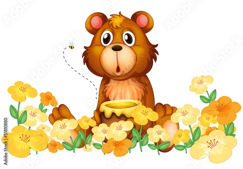 A bear with a honey at the garden