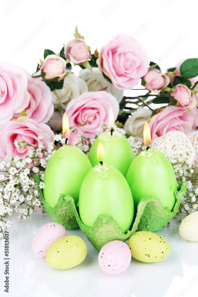 Easter candles with flowers close up