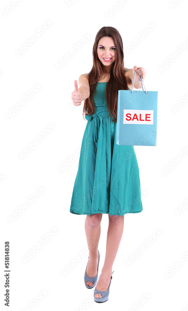Young beautiful girl in green dress holding bright shopping Young beautiful girl in green dress holding bright shopping