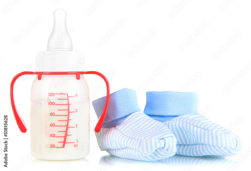 Fototapeta premium Bottle for milk formula with booties isolated on white