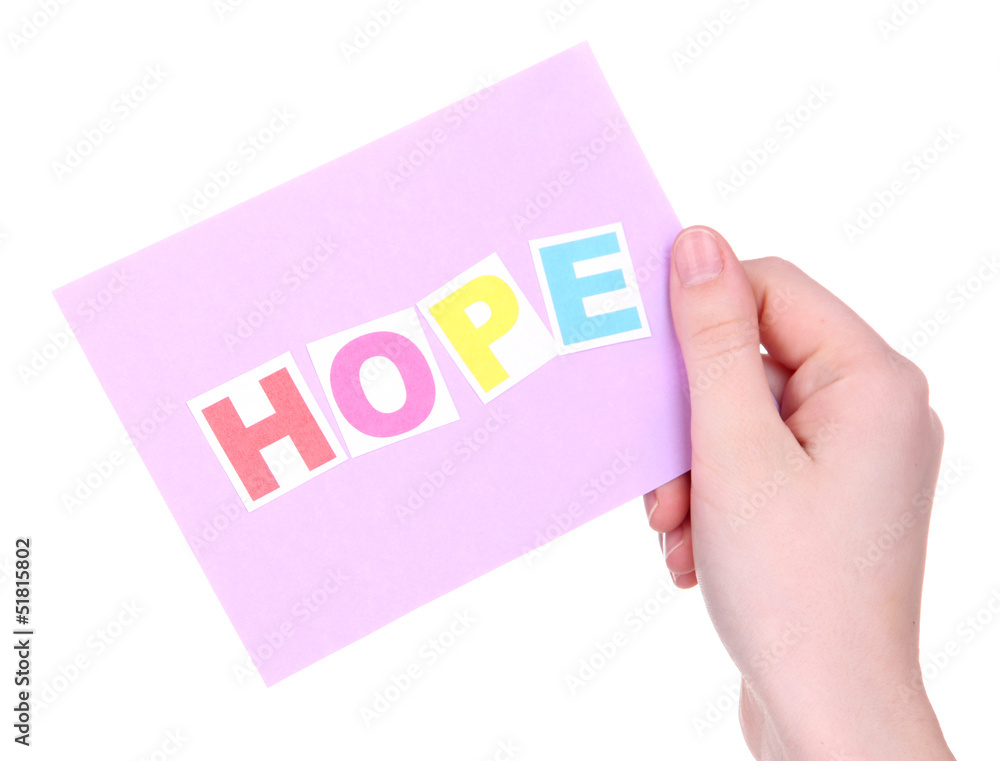 Hope word on piece paper in hand isolated on white Hope word on piece paper in hand isolated on white