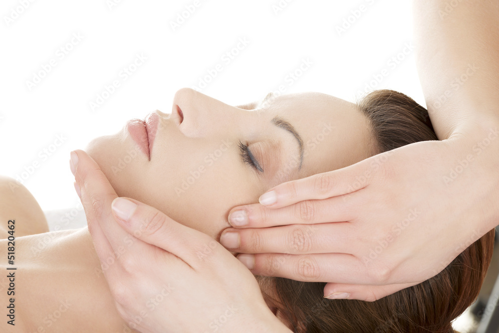 Woman enjoy receiving face massage