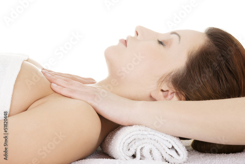Attractive woman relaxing beeing massaged