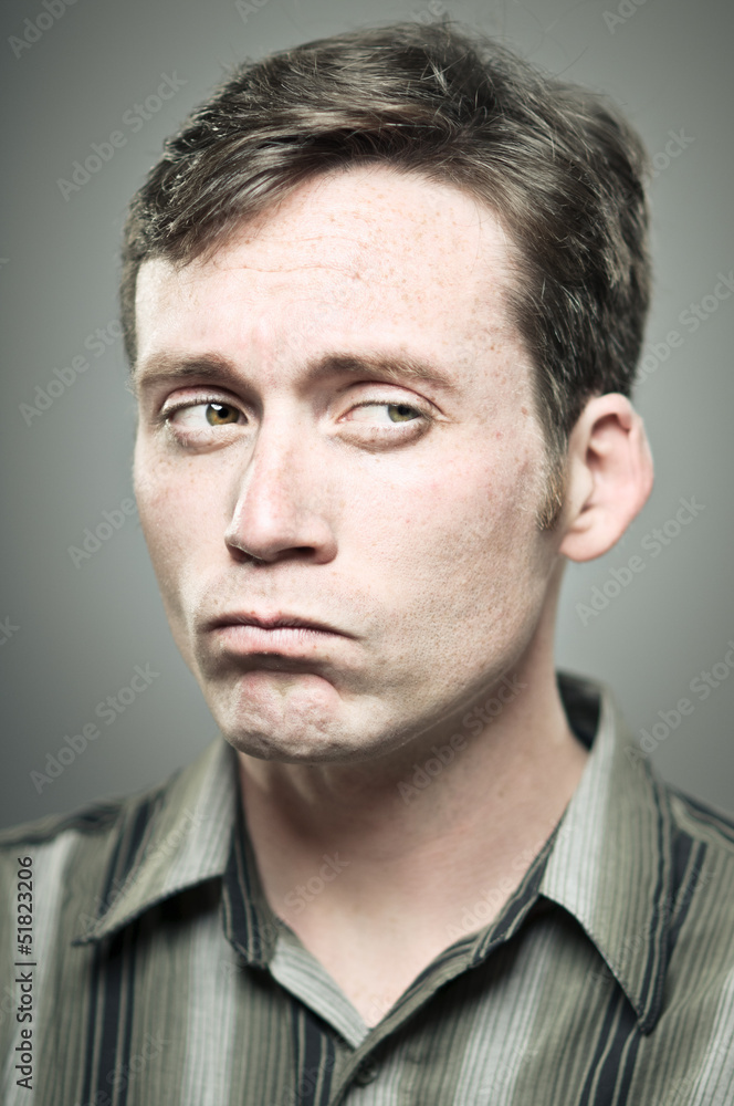 Young Caucasian Man With A Suspicious Expression Young Caucasian Man With A Suspicious Expression