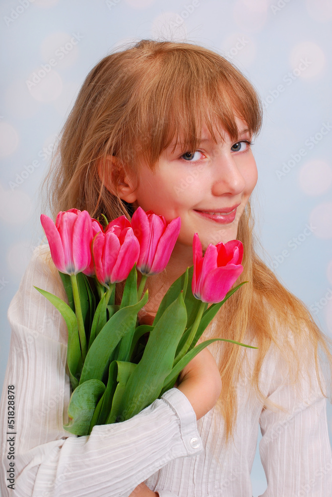 beautiful girl with bouquet of tulips