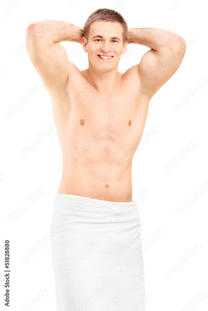 Fototapeta premium Handsome young man in towel posing
