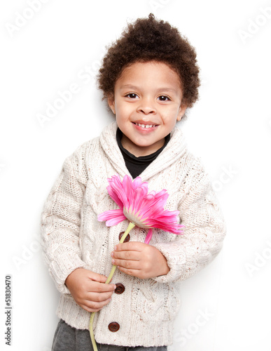 Cute child smiling with big pink flower