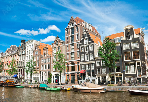 Amsterdam canals and typical houses with summer sky