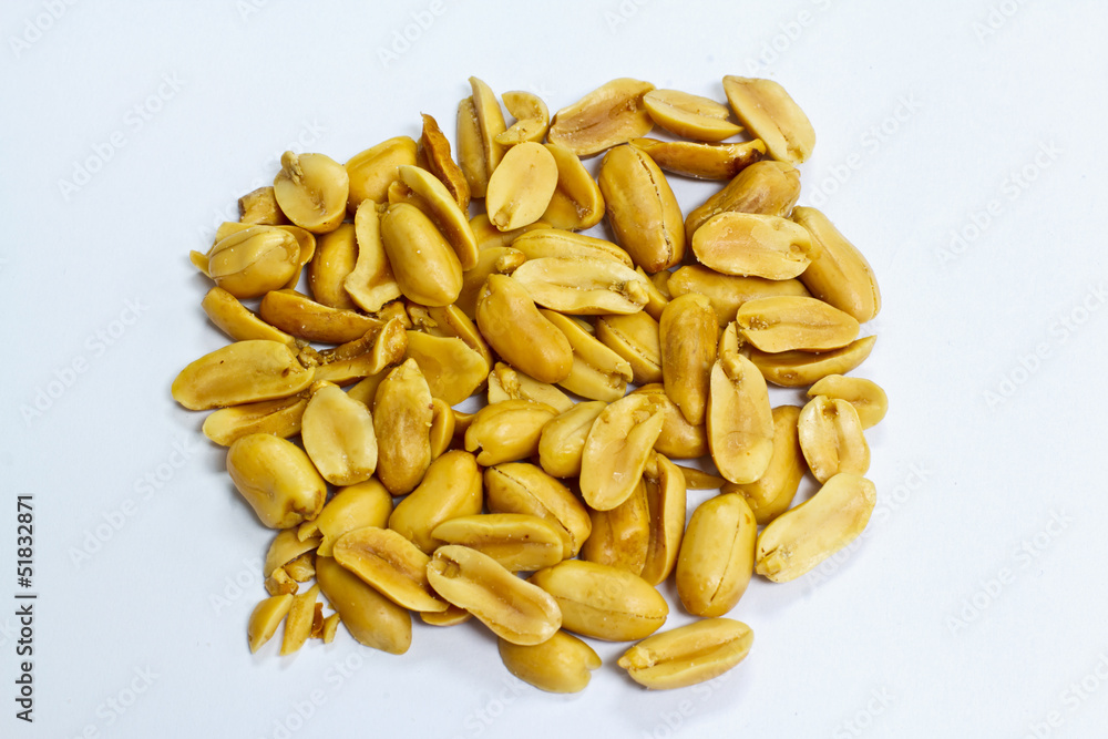 Dry roasted peanuts on a white background. Dry roasted peanuts on a white background.