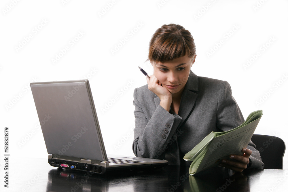 Businesswoman reading a newspaper Businesswoman reading a newspaper
