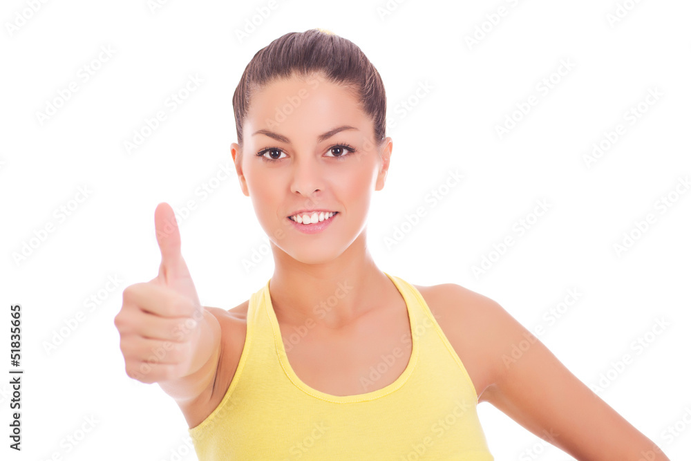 Beautiful young woman making thumbs up sign Beautiful young woman making thumbs up sign