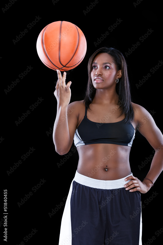 Basketball player spinning ball on his finger
