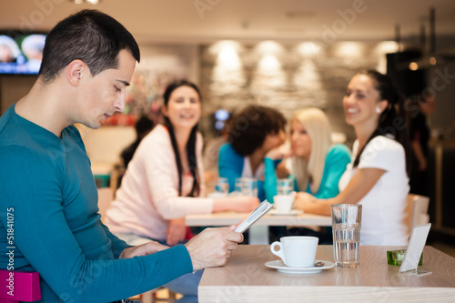Group of girl watching handsome man in cafe