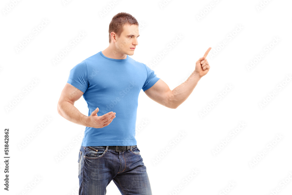 An anger young man pointing with finger and threatening An anger young man pointing with finger and threatening