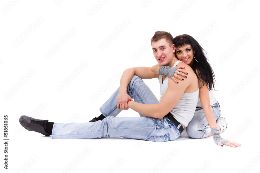 young fitness couple wearing jeans in the studio young fitness couple wearing jeans in the studio