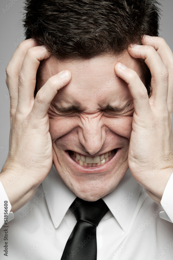 Businessman in white shirt expressing problems.