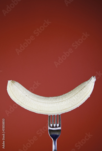 Banana on red background