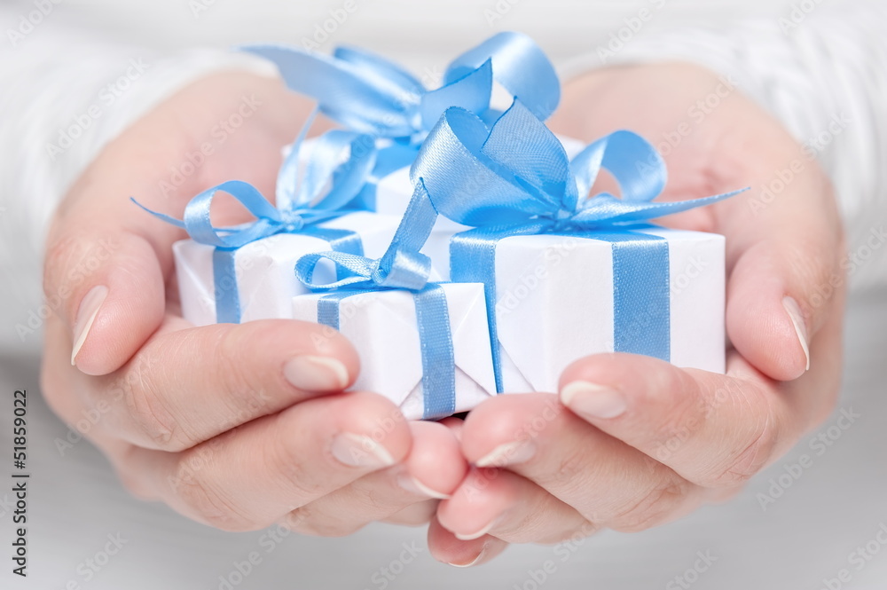 Boxes with gifts in their hands Boxes with gifts in their hands