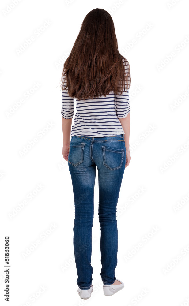 back view of standing young beautiful  brunette woman.