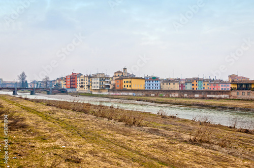 river with city houses and bridge in Parma - Italy