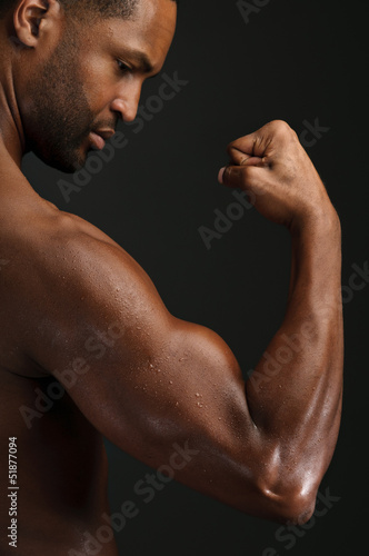 Young African American Man Flexing Biceps
