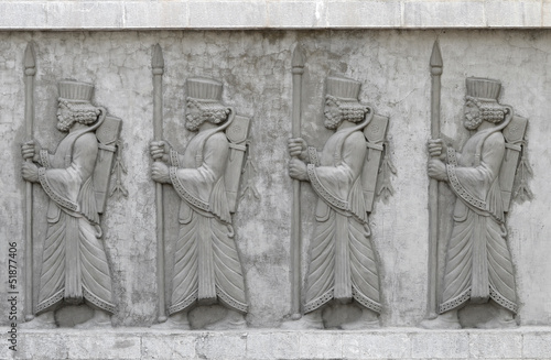 Achaemenid soldiers, cement relief on wall photo