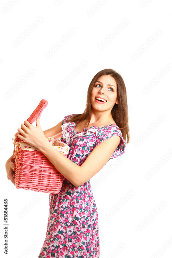 Happy girl holding an open laundry basket on white background Happy girl holding an open laundry basket on white background