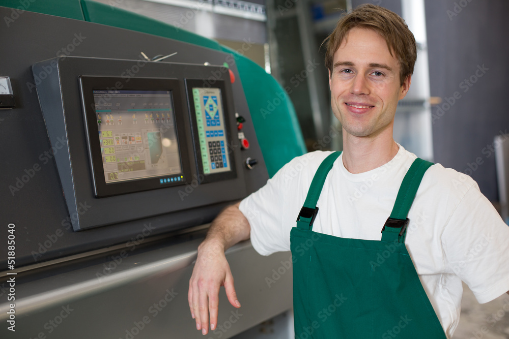 Glazier operating a grinding machine Glazier operating a grinding machine