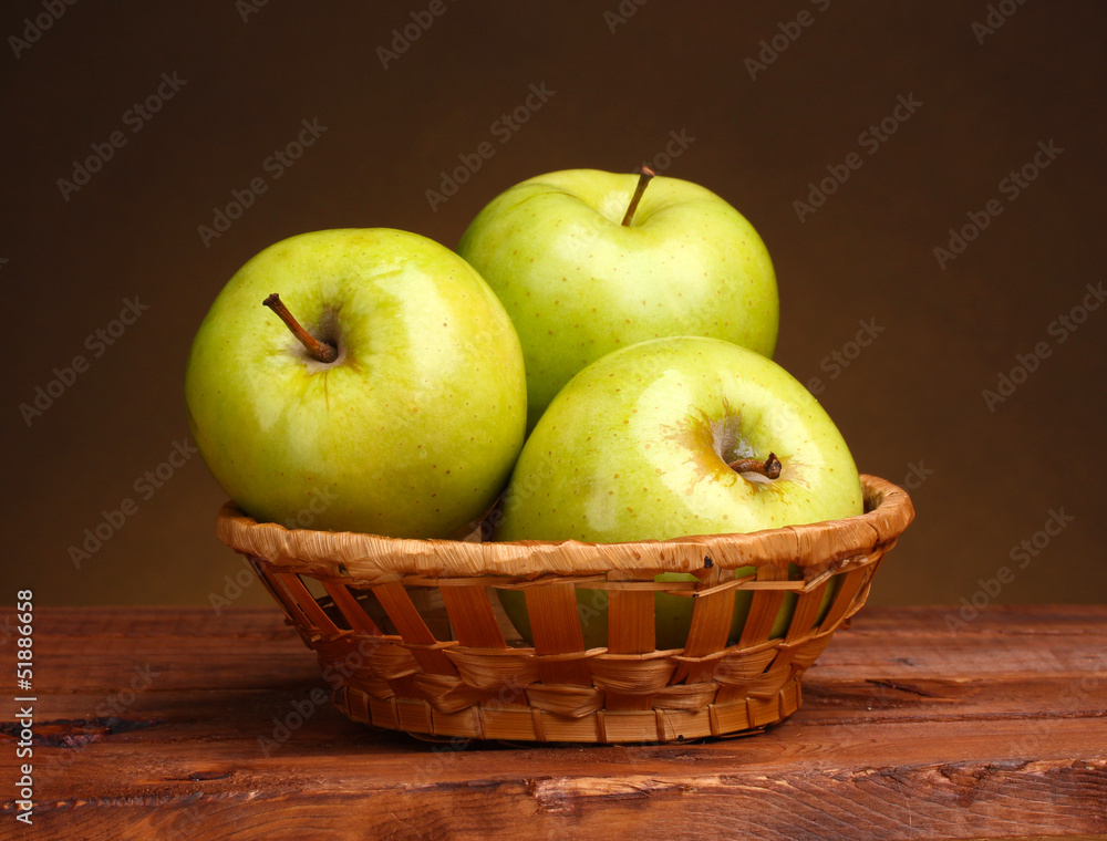 juicy green apples in basket on wooden table on brown juicy green apples in basket on wooden table on brown