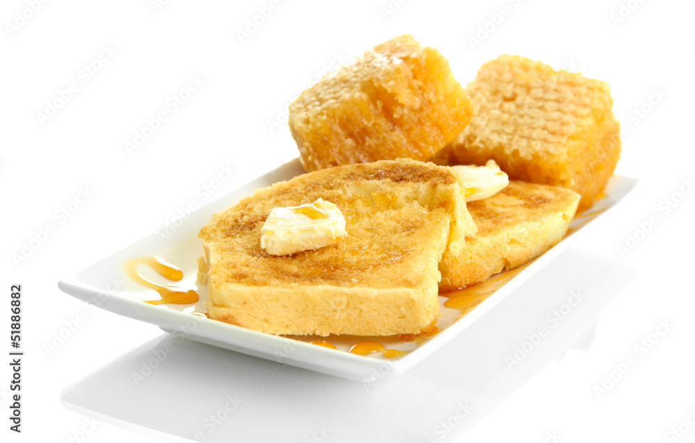 White bread toast with honey on plate, isolated on white White bread toast with honey on plate, isolated on white