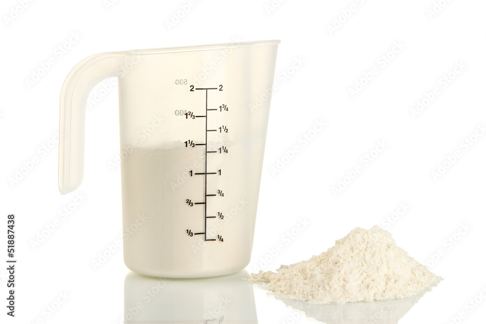 Measuring cup with flour isolated on white Measuring cup with flour isolated on white