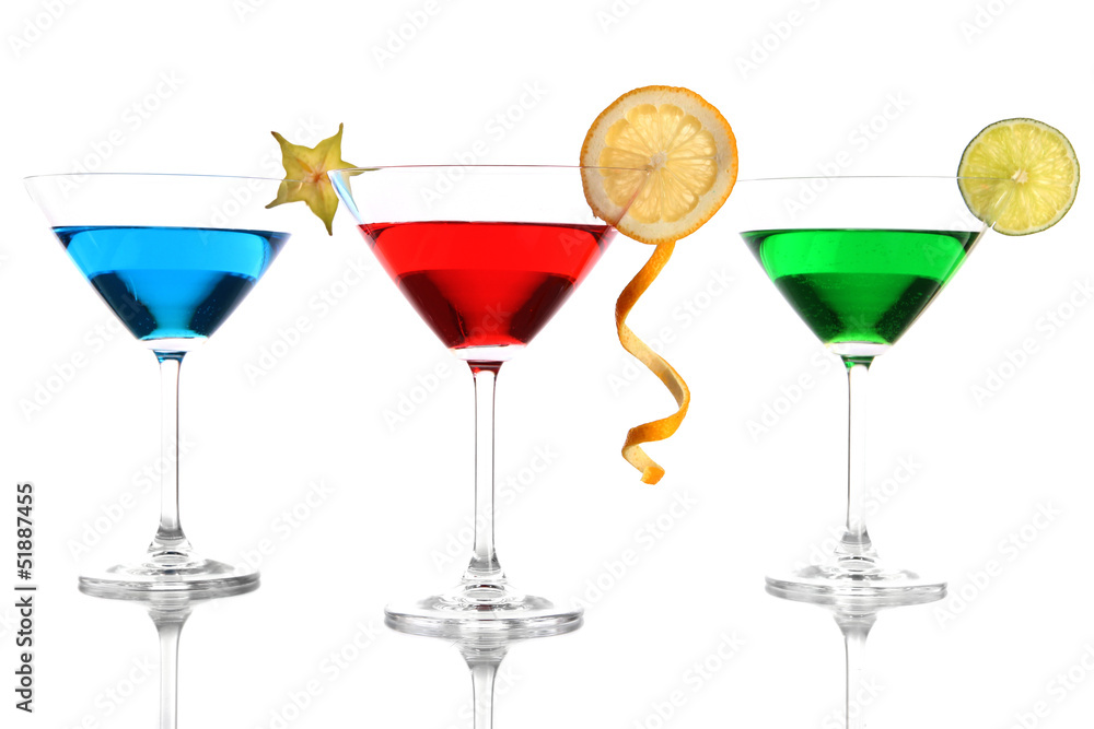 Alcoholic cocktails in martini glasses isolated on white Alcoholic cocktails in martini glasses isolated on white