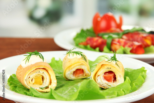 Egg rolls with cheese cream and paprika,on plate,