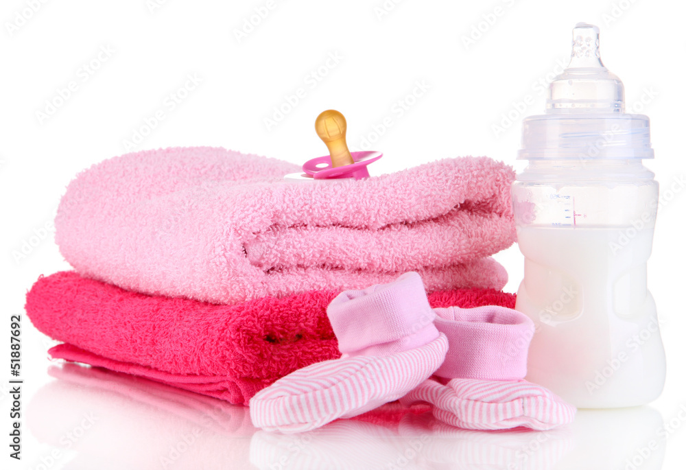 Bottle for milk with towels and nipple isolated on white