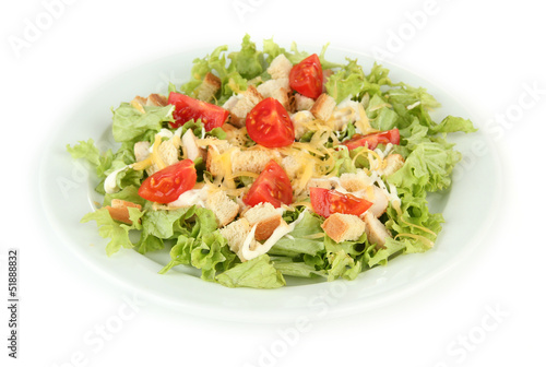 Caesar salad on white plate, isolated on white