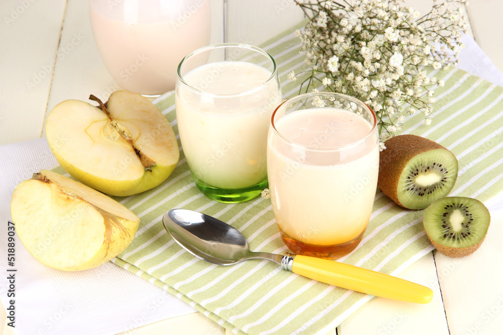 Delicious yogurts with fruits in glasses Delicious yogurts with fruits in glasses