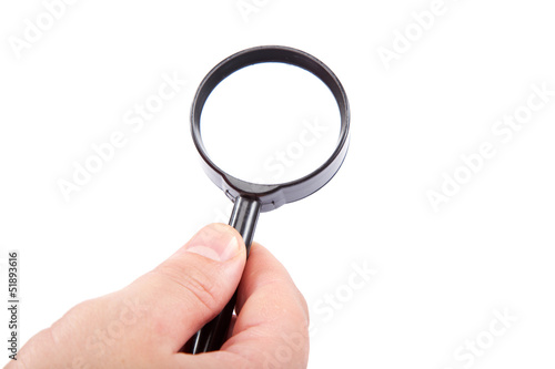 Hand holding magnifying glass isolated on white background.