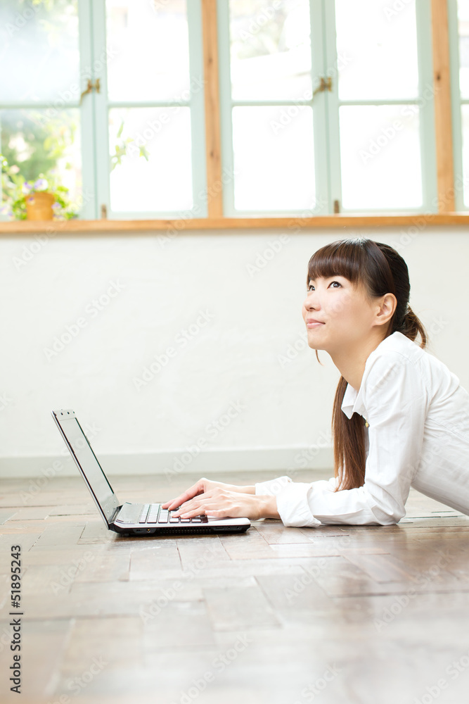 Beautiful asian woman using a laptop computer Beautiful asian woman using a laptop computer