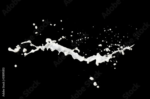 milk flow splash isolated on black background