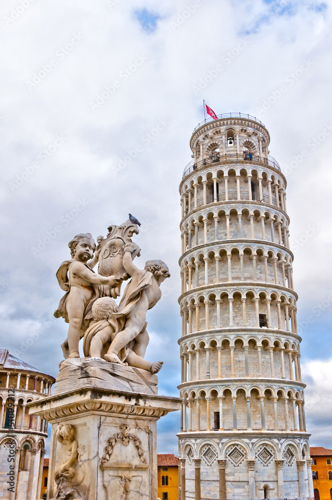 Leaning Tower of Pisa with angels statue, Tuscany - Italy