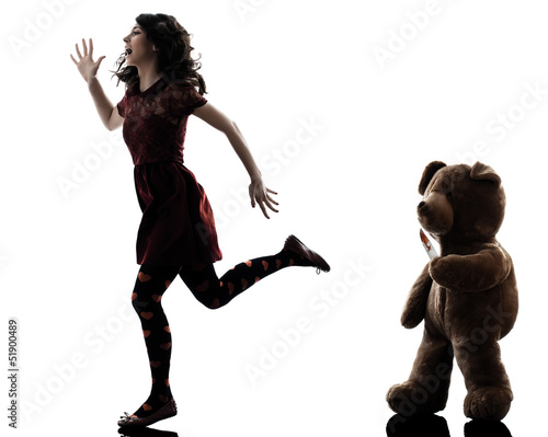 strange young woman and killer teddy bear silhouette photo