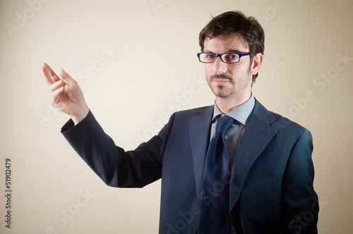 success businessman pointing with pen
