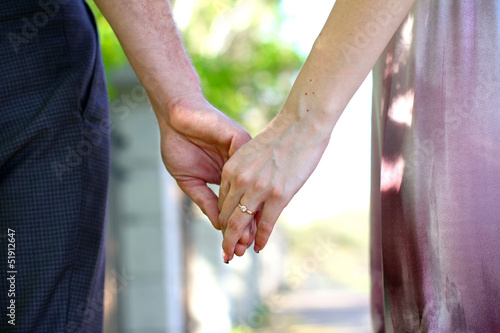 Close-up Holding Hands with Wedding Ring