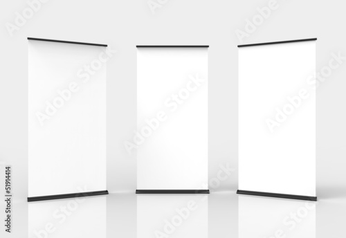 Three blank roll-up poster banner displays