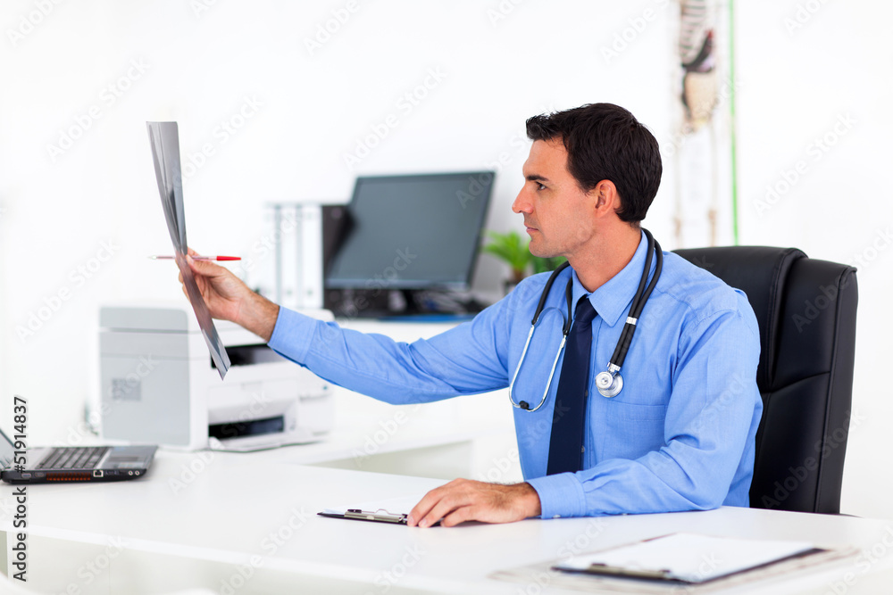 medical doctor analyzing patient's x-ray