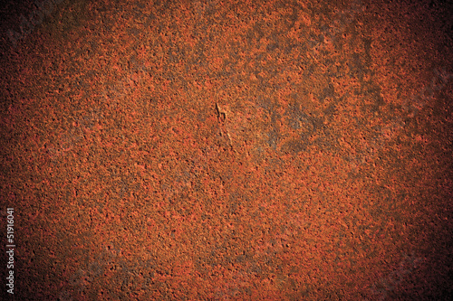 Dark edged rusty metal plate background