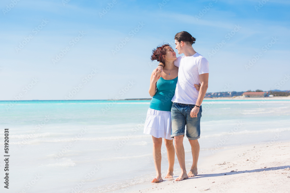 Young Couple Walking on Caribbean Beach Young Couple Walking on Caribbean Beach
