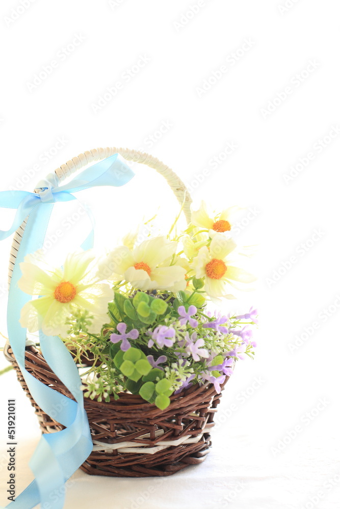 artificiate flower in bamboo basket on white background artificiate flower in bamboo basket on white background