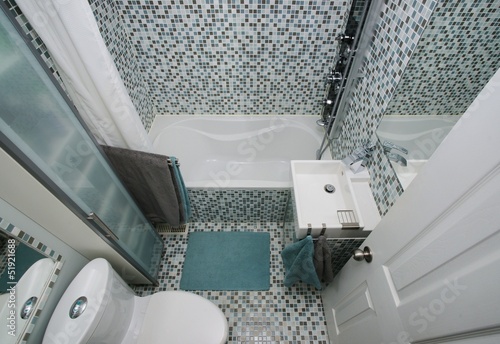 Small, modern bathroom interior. Mosaic tiles.