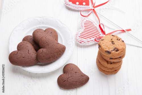 Heart shaped biscuits of chocolate with rustic cookies